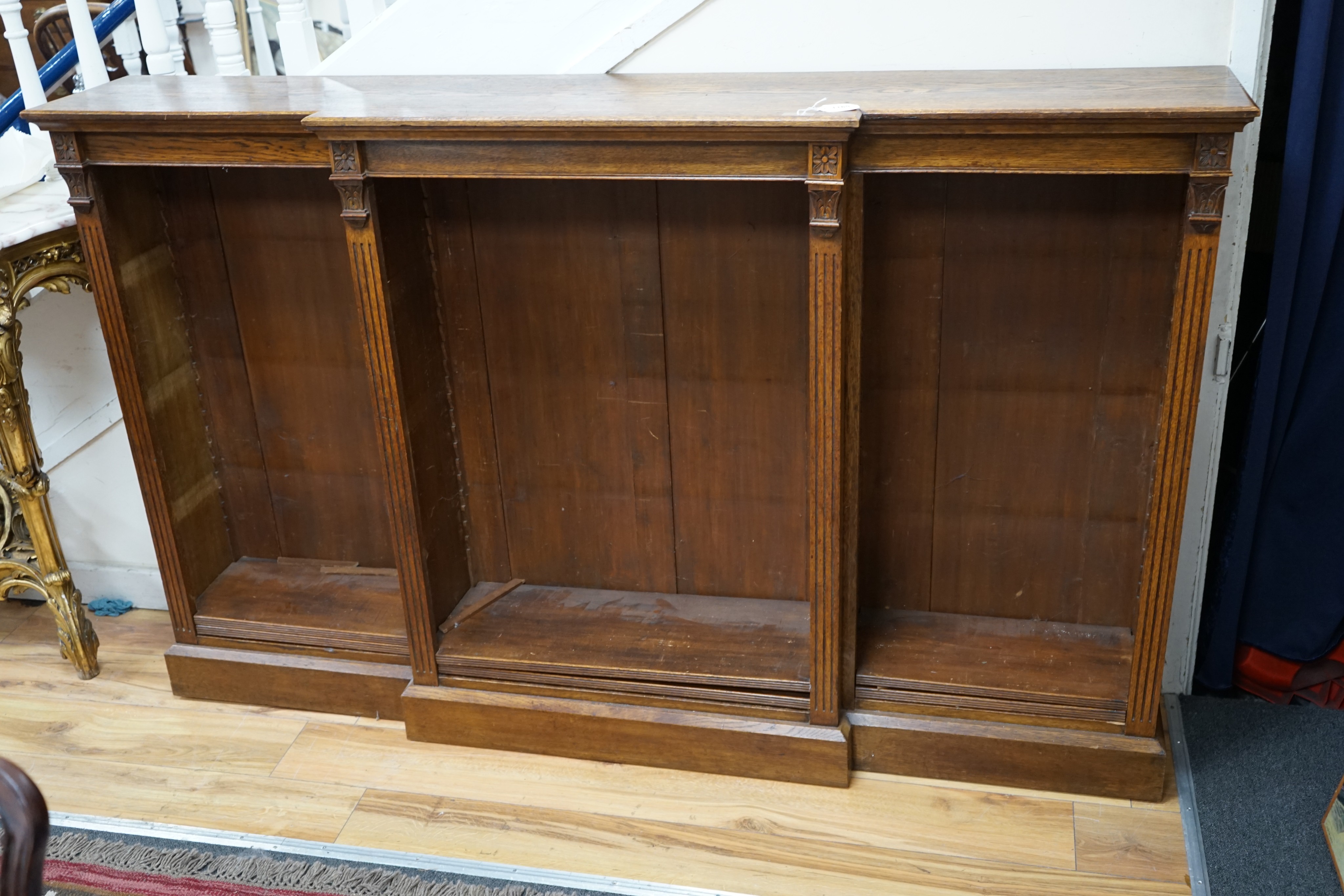 A late Victorian oak breakfront open dwarf bookcase, length 183cm, depth 34cm, height 114cm